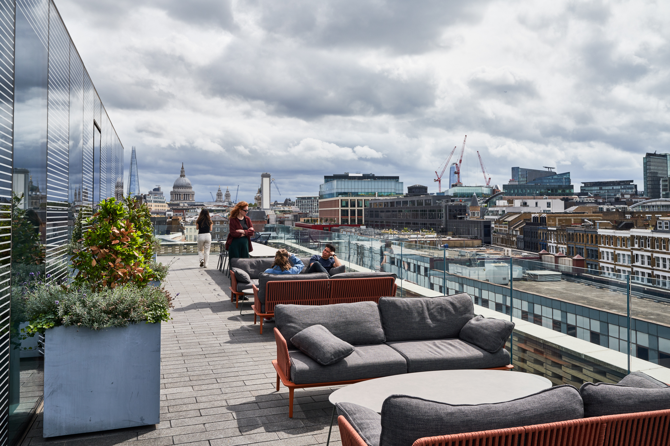 Rooftop terrace at Publicis Sapient’s London office featuring modern outdoor seating with views of St. Paul's Cathedral and The Shard.