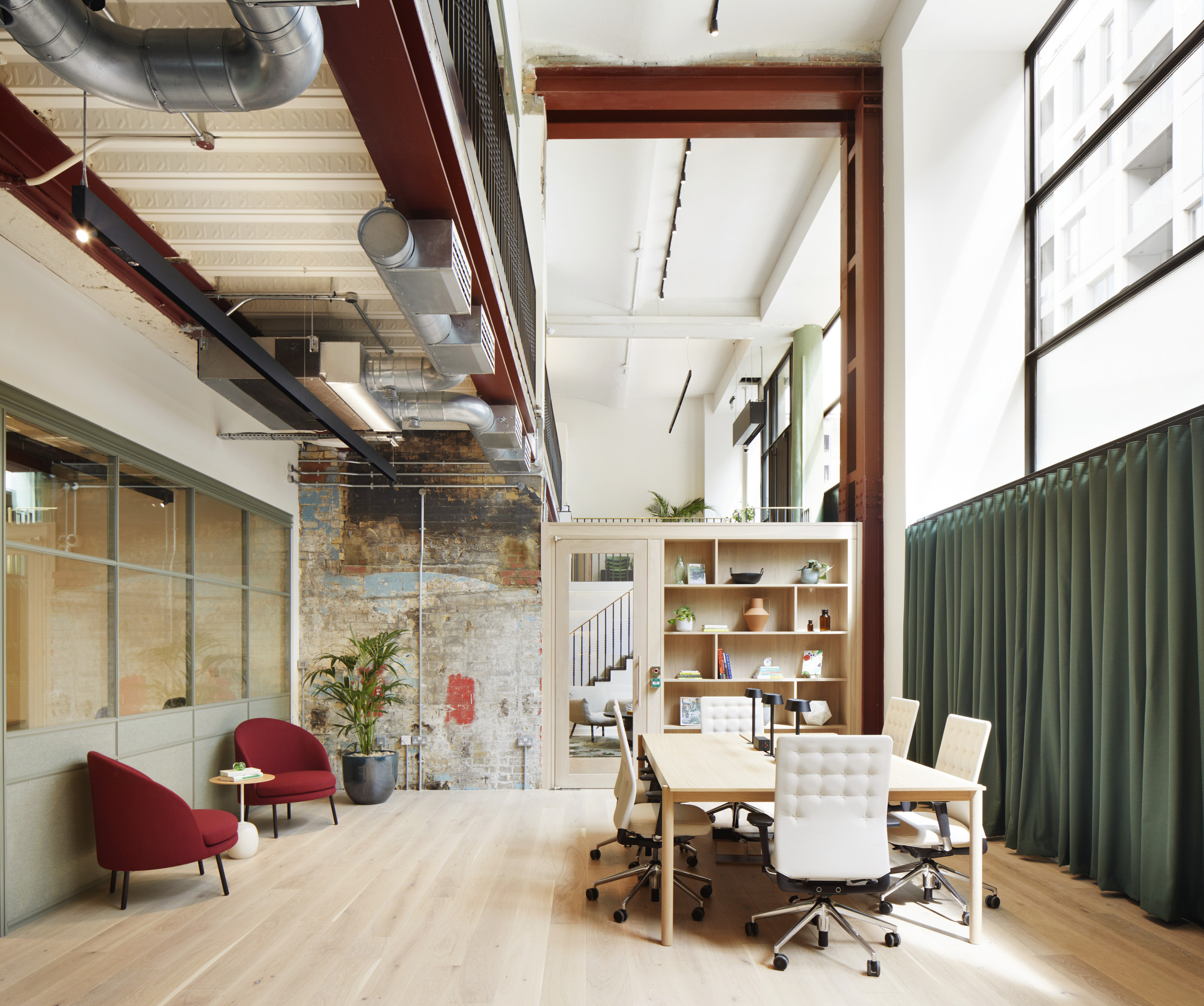 Contemporary meeting space at Fora Greencoat Place co-working space, designed by Modus, combining industrial elements with modern office furniture and decor, perfect for collaborative work sessions.