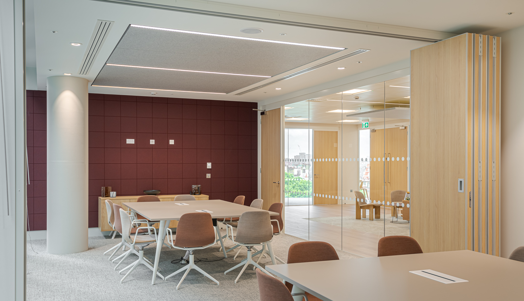 Well-equipped tenant-ready conference room at Landsec 100 Victoria Level 6, designed with modern furniture, acoustic panels, and large windows that offer views of London, perfect for productive meetings. Designed by Modus Workspace.