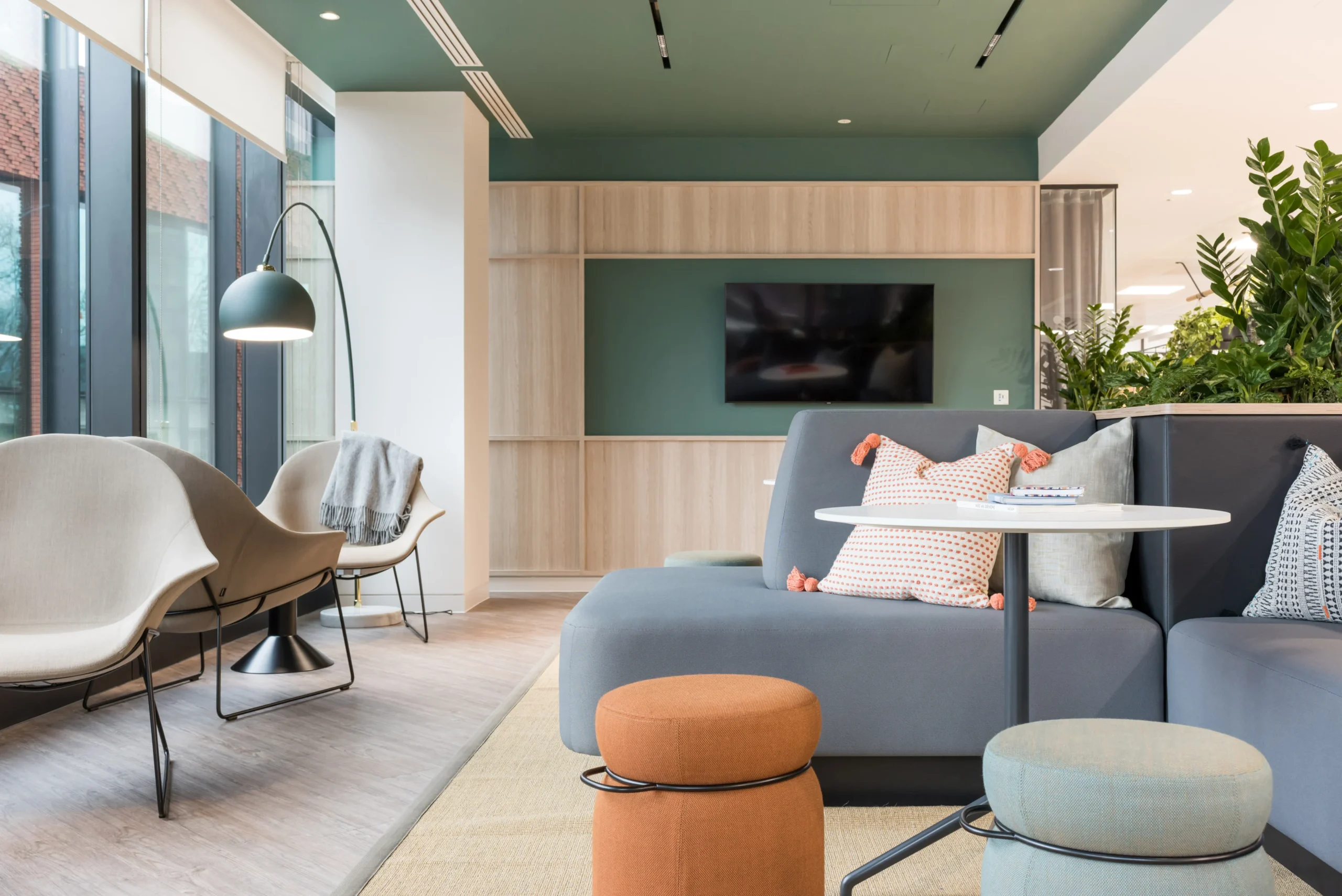 A communal lounge space at London and Oriental, designed by Modus Workspace. The area features contemporary seating, stylish lighting fixtures, and an inviting atmosphere, perfect for informal meetings and relaxation.