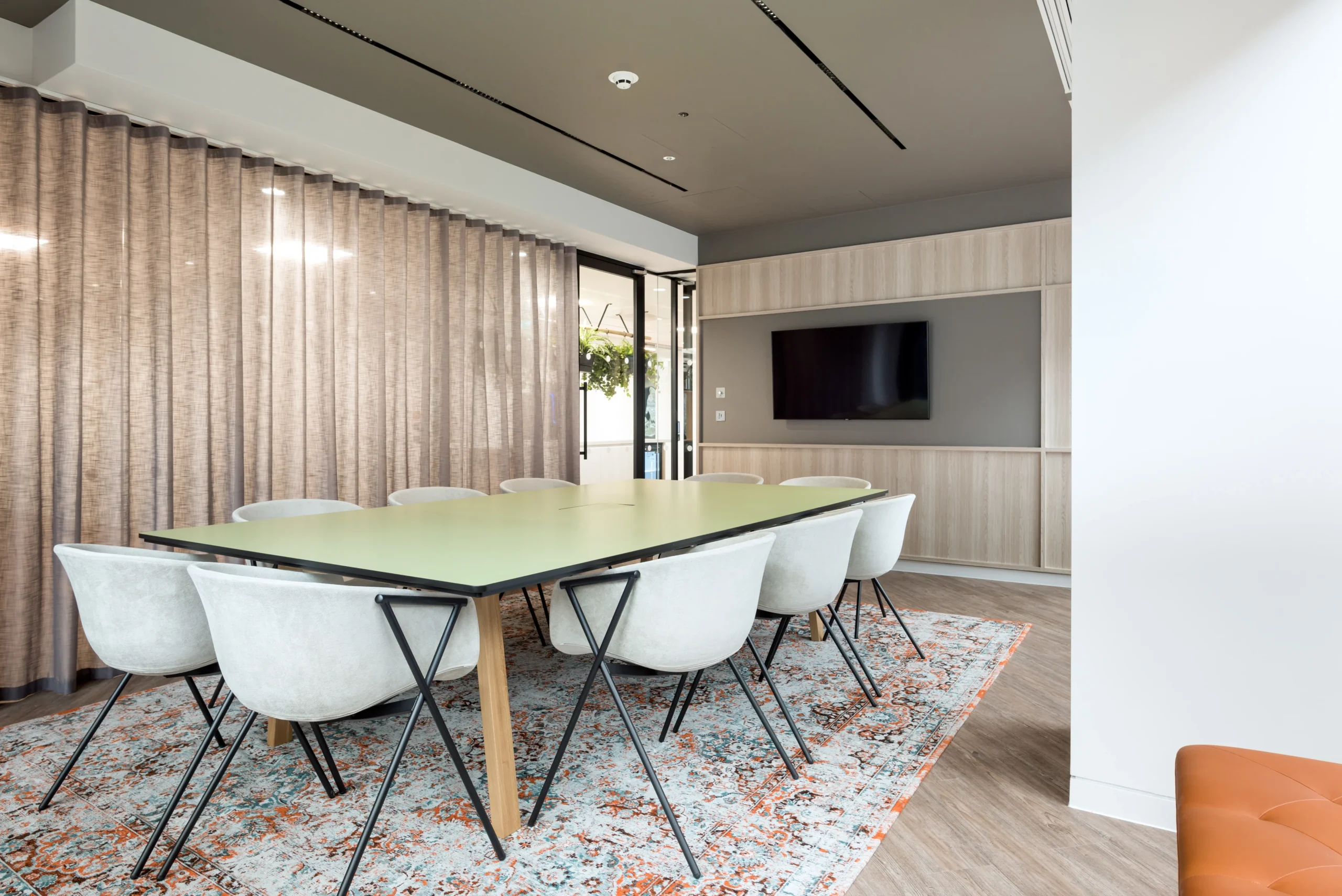 A meeting room at London and Oriental, designed by Modus Workspace. The room is equipped with a large meeting table, comfortable chairs, and modern decor that promotes a professional yet welcoming atmosphere.