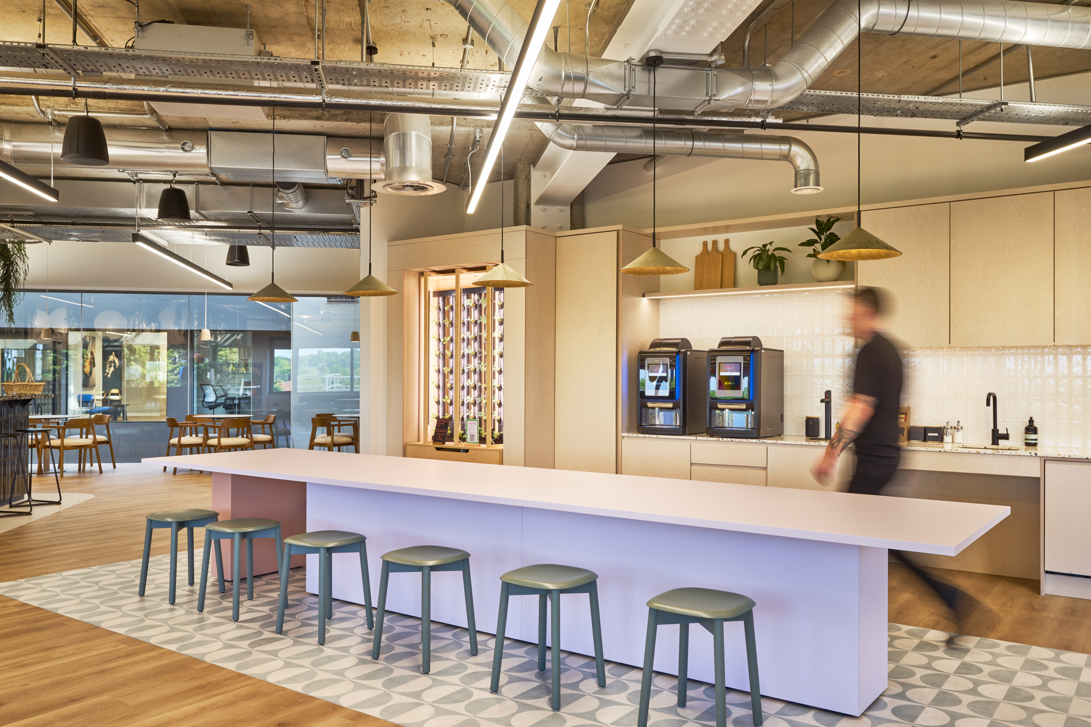 The teapoint at Nomad Foods features a sleek, contemporary design, with ample space for employees to gather and enjoy a shared meal, echoing Modus Workspace’s dedication to modern workspace design.