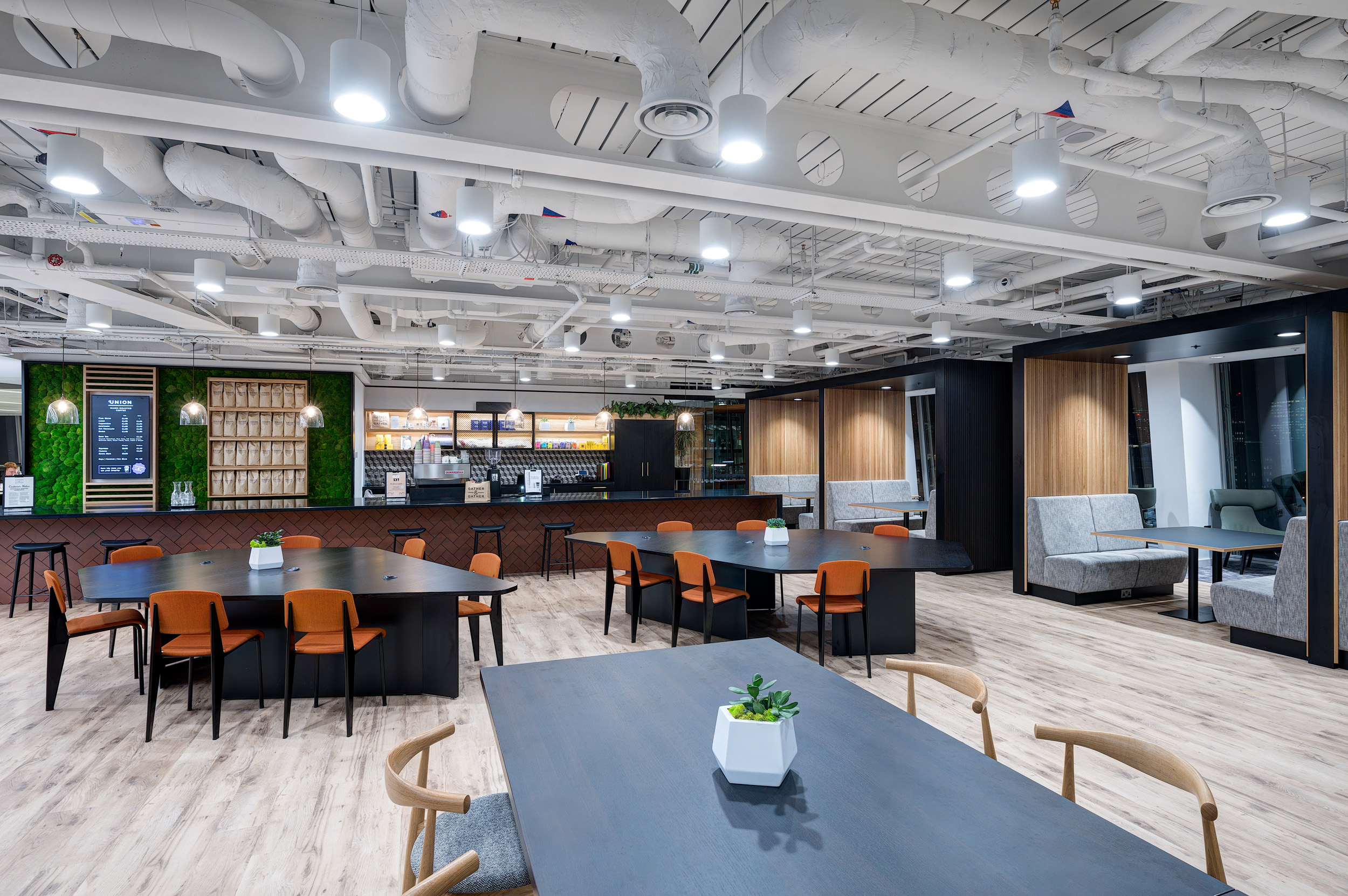 A view of the MITIE teapoint area, part of the office's Gather & Gather café, designed to be a social hub within The Shard. The space supports employee interaction and connectivity.