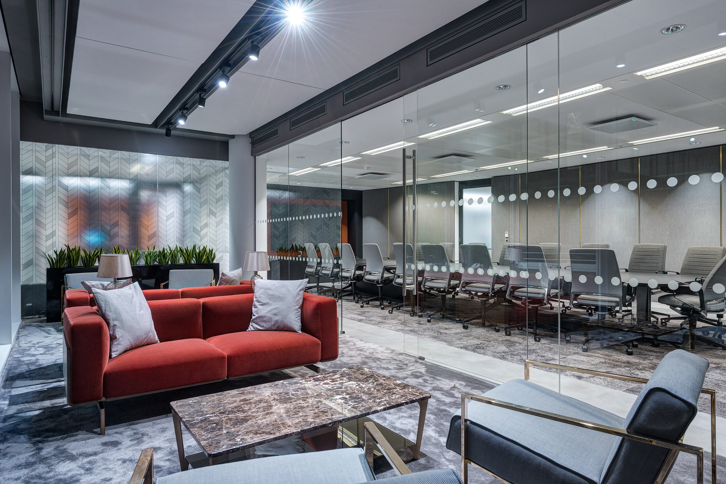 Lounge and meeting area at MITIE’s office in The Shard, featuring modern design elements and flexible seating arrangements.