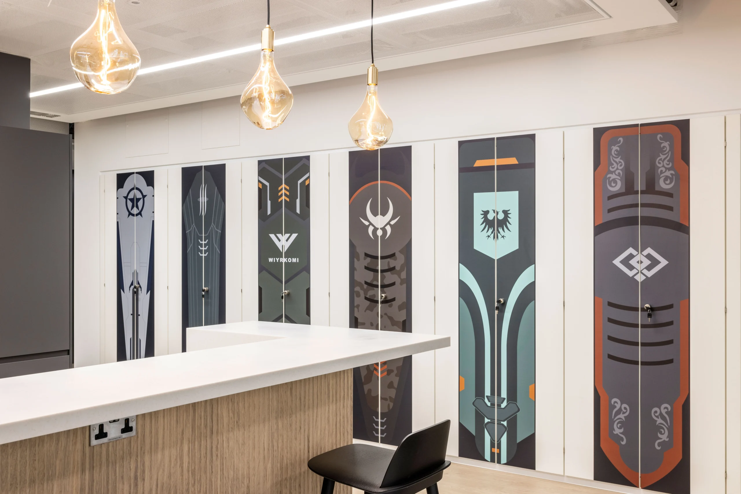 Lockers with custom graphics showcasing CCP Games' distinctive branding in their London workspace.