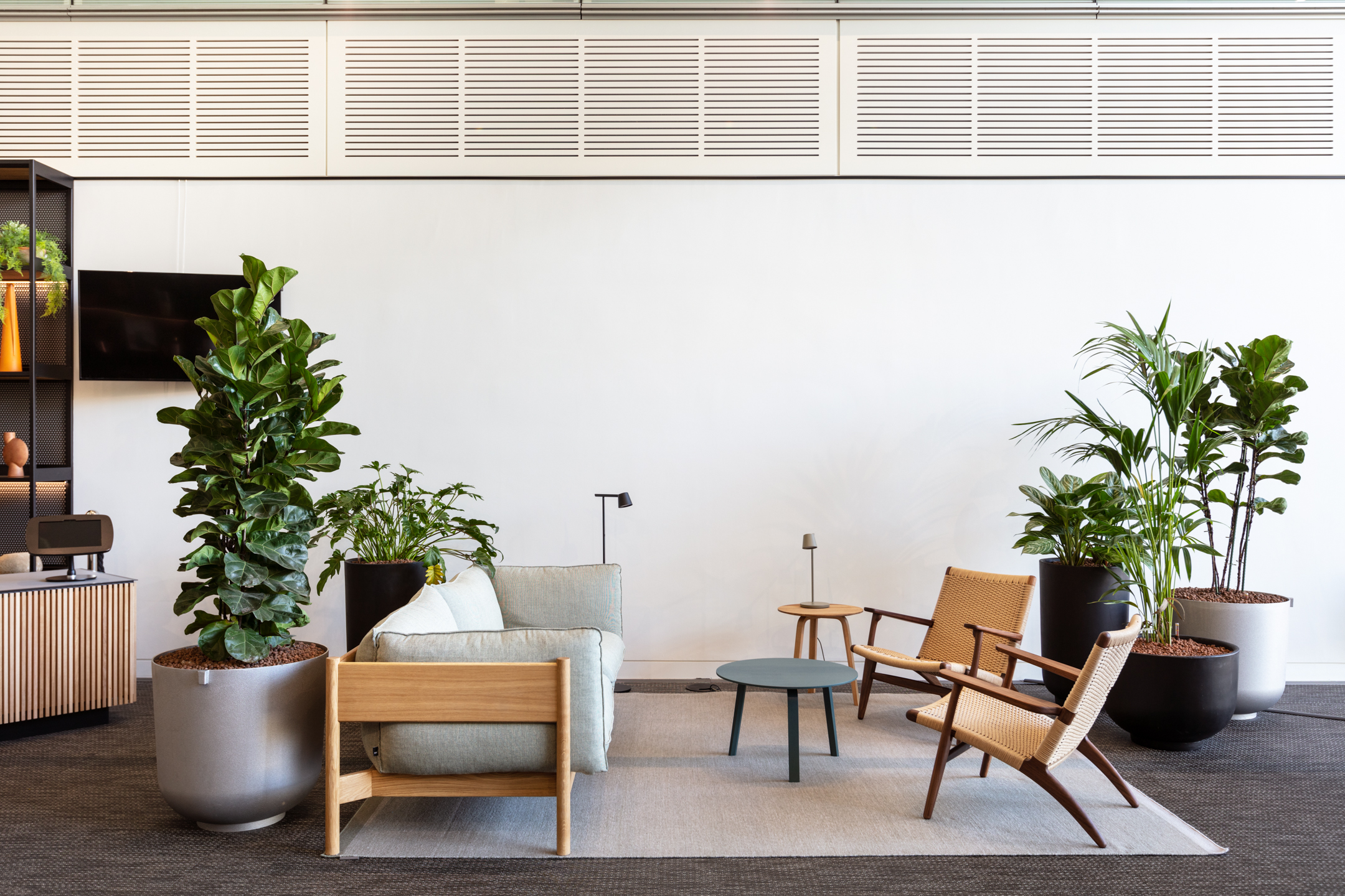 Seating area featuring a sofa and two chairs with a coffee table at Chiswick Business Park, Building 9