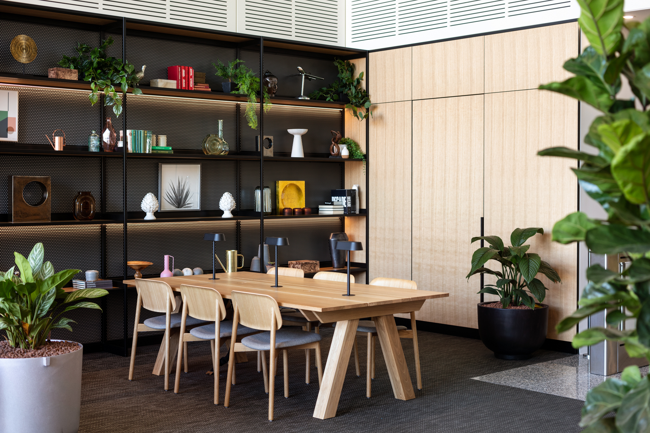 Seated area with a black bookshelf at Chiswick Business Park, Building 9