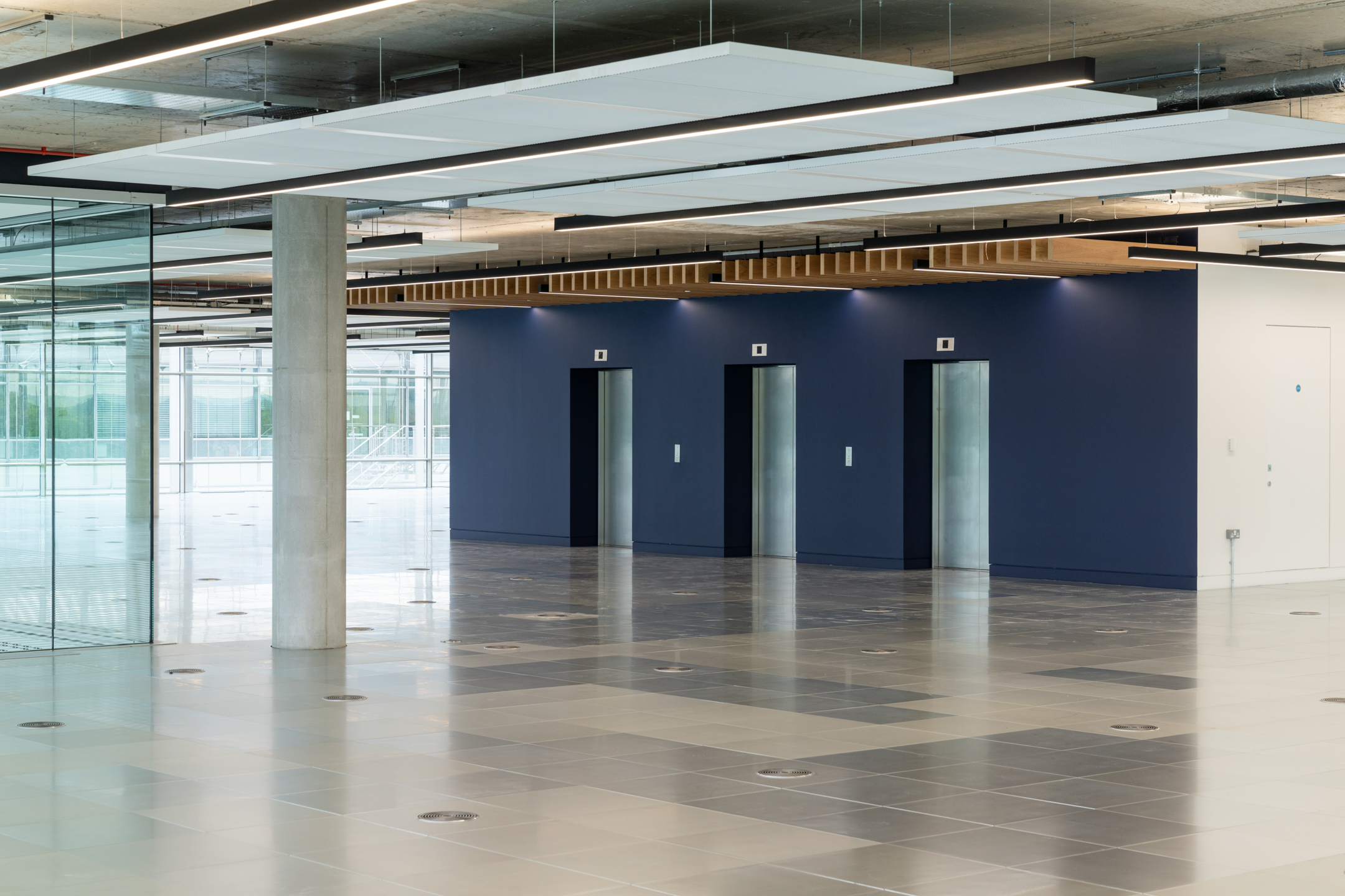 Spacious open floor at Chiswick Business Park Building 12 showcasing flexible office space - Cat-A project by Ambit