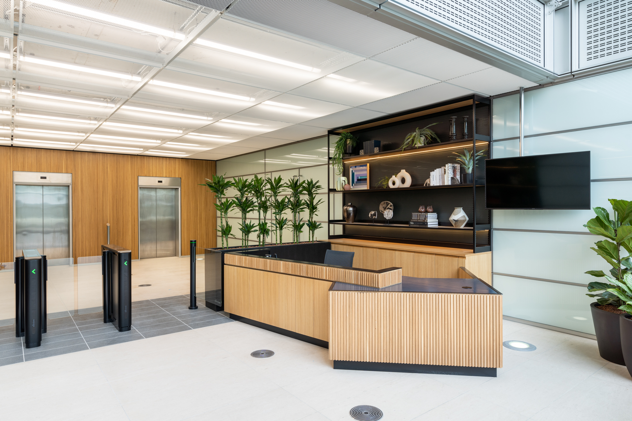 Reception Area featuring oak desk and biophilic plants