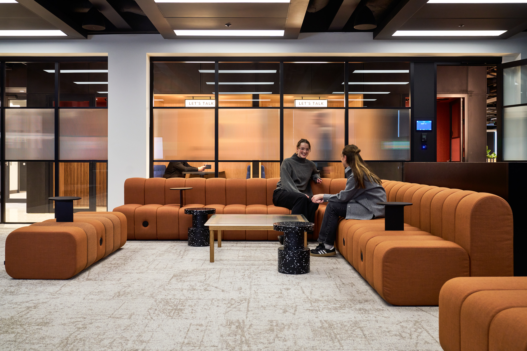 Sofa seating arrangement in a breakout space encouraging casual collaboration and team connection
