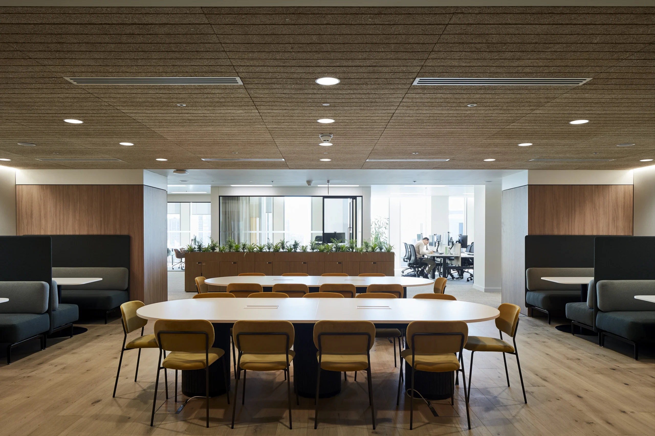 Stylish breakout space with soft seating and informal work zones, designed to foster collaboration and comfort