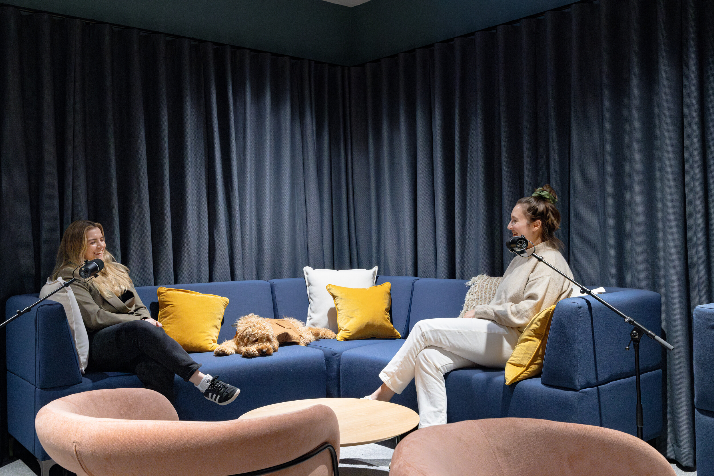 Acoustically treated podcast room with recording equipment, designed for high-quality content creation